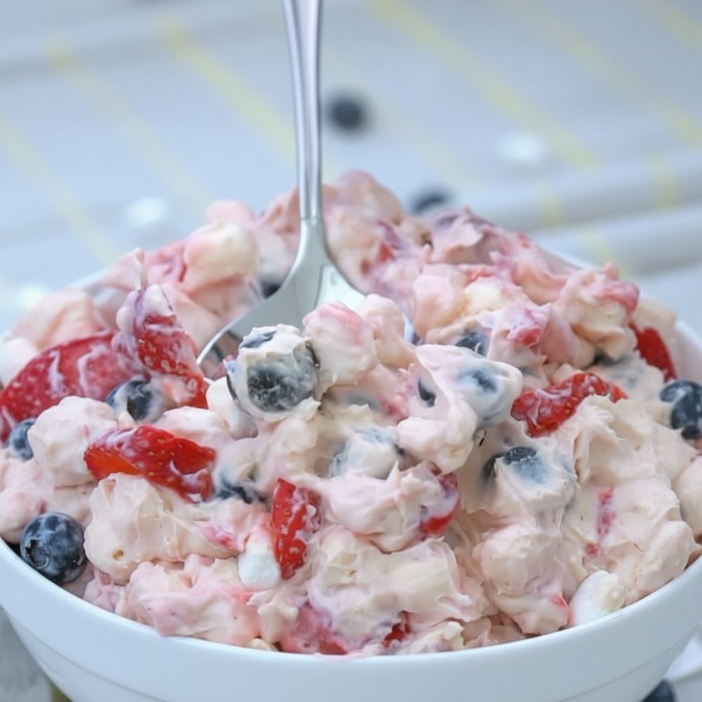 Easy Patriotic Berry Cheesecake Salad (No-Bake Dessert) 1 red white and blue cheesecake salad featured 1780676677455